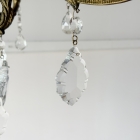 優雅な曲線が空間を華やかに彩る、真鍮の重厚な質感としずく型クリスタルが煌めく8灯式ガラスシャンデリア【sy470】