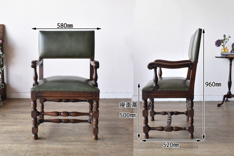 どっしりとしたオーク材の重厚感が魅力的な英国アンティークのアームチェア（c14）。力強い木目と安定感のあるフォルムが目を引く、肘掛け椅子の正面写真。